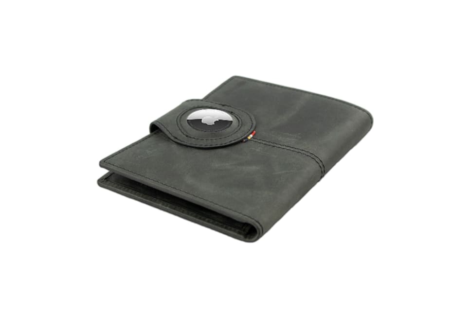 Backview sideways with AirTag of the AirTag Passport Holder in Brushed Brushed Black.