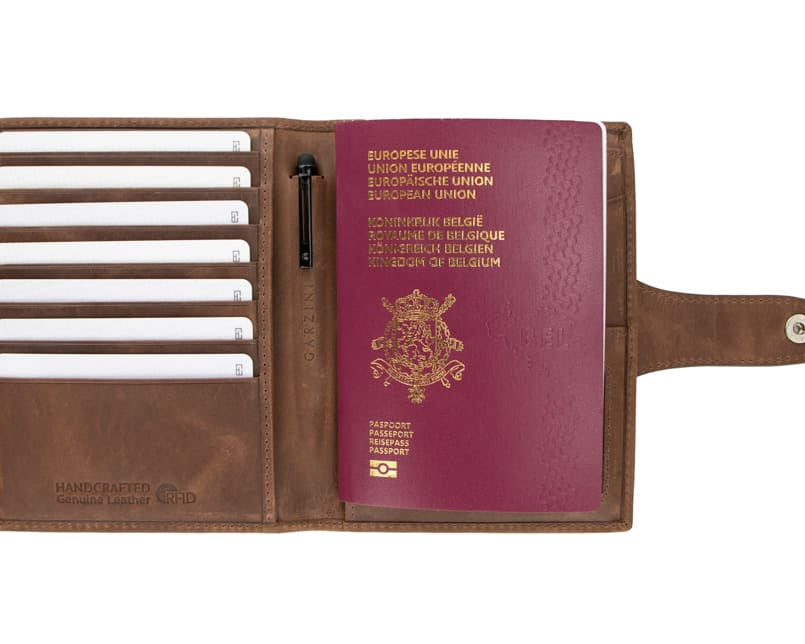 Open view of the AirTag Passport Holder in Brushed Brushed Brown with cards and passport inside. 