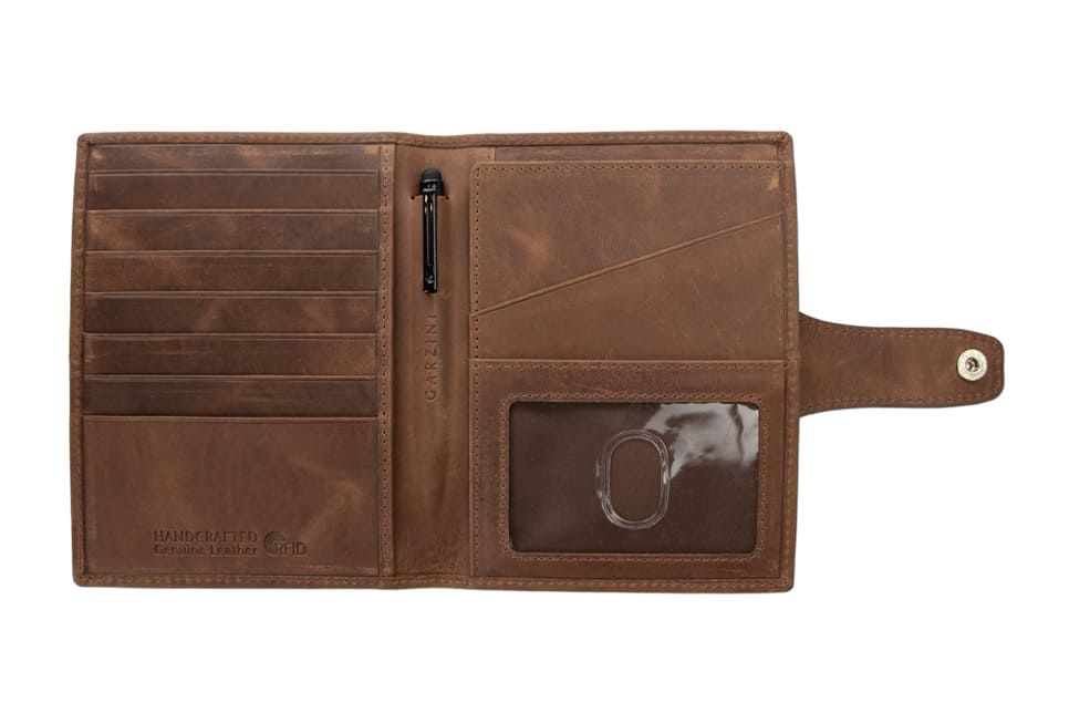 Open view of the AirTag Passport Holder in Brushed Brushed Brown with no cards.