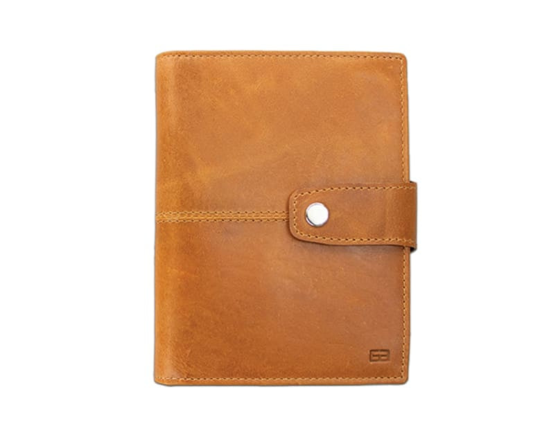 Frontview of the AirTag Passport Holder in Brushed Brushed Cognac.
