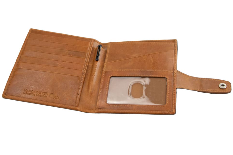 Open inside view with AirTag of the AirTag Passport Holder in Brushed Brushed Cognac