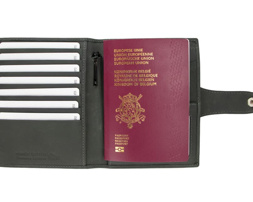 Open view of the AirTag Passport Holder in Vintage Carbon Black with cards and passport inside. 