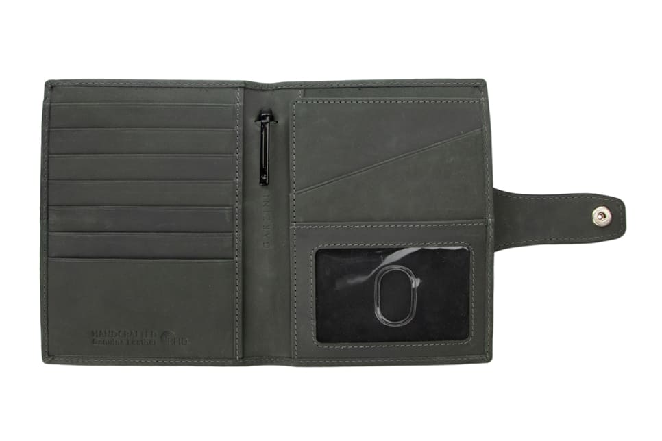 Open view of the AirTag Passport Holder in Vintage Carbon Black with no cards.