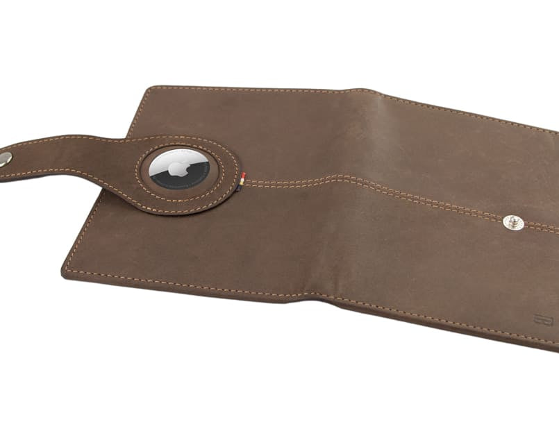 Open outside view with AirTag of the AirTag Passport Holder in Vintage Java Brown.