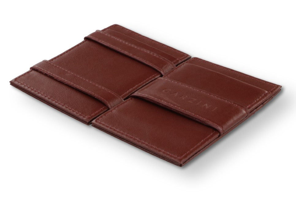 Open view of the Essenziale Magic Wallet Vegan in Cactus Burgundy with the money strap to secure money.